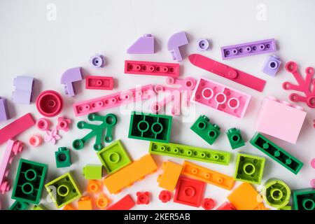 Multicolored plastic building blocks of the designer. Educational developing toys background.copz space Stock Photo