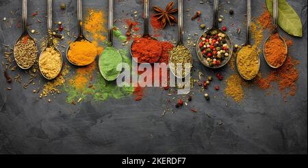 Various seasonings and spices on black stone plate Stock Photo