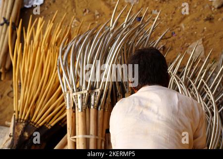 A Man sale farming tool's on a street in Pushkar, Rajasthan, India on November 11, 2022. Photo by ABACAPRESS.COM Stock Photo