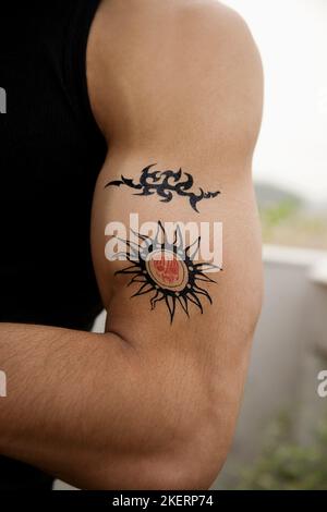 Tattoos on a man's arm Stock Photo