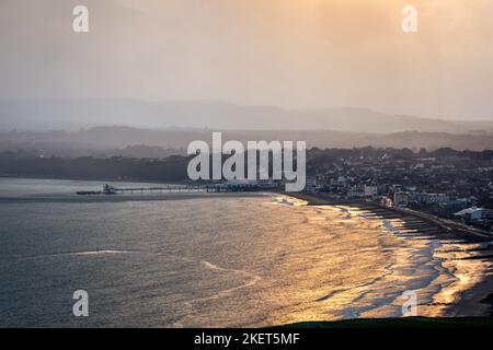 Stormy sunset view of Sandown seafront from Culver Down Isle of Wight south east England Stock Photo
