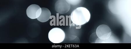 Blurred lights, gray, deep blue background, banner texture. Abstract bokeh with soft light header. Wide screen wallpaper. Panoramic web banner with co Stock Photo