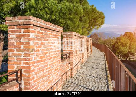 Walking trail lookout on a brick wall Stock Photo