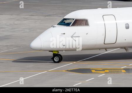 Nose and cockpit of the aircraft during taxiing on the runway Stock Photo