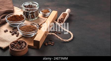 Coffee beans, ground and granulated coffee on a brown background. Stock Photo
