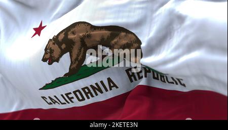 Close-up view of the California State flag waving in the wind. California is a federated state of the US located in the South West Coast. Fabric textu Stock Photo