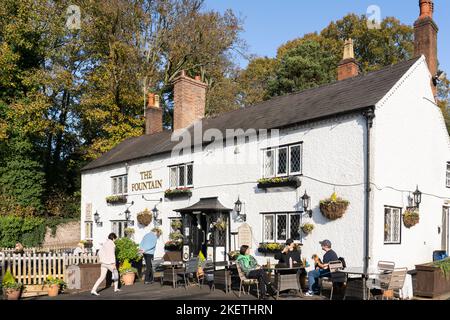 People sitting outside The Fountain at Clent, - a traditional country ...