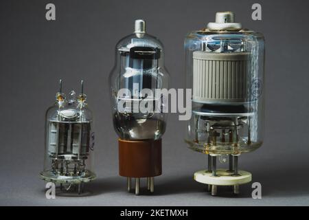 Old vacuum tube on gray background Stock Photo