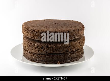 Unfrosted chocolate cakes isolated on white background with selective focus Stock Photo