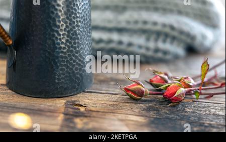 Beautiful textural teapot on a blurred background in a cozy home interior. Stock Photo