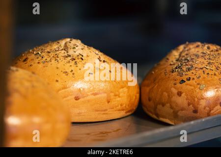 Close-up, freshly baked buns in the bakery close-up. Stock Photo