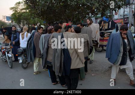 Gujranwala, Pakistan, November 14, 2022. Warm clothes are being selling at a roadside stalls as the demand of warm clothes increased in city on the arrival of cold waves of winter season, in Gujranwala on Monday, November 14, 2022. Stock Photo