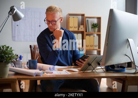 Professional architect working in bureau on new project Stock Photo