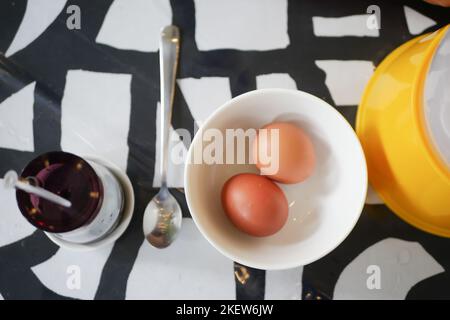 overhead view of half boil eggs in a bowl. Stock Photo