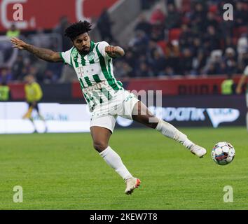 Petrus Boumal of Ujpest FC competes for the ball with Jose Marcos