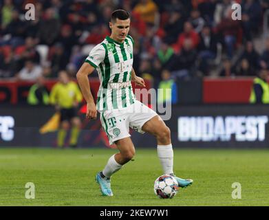 Amer Gojak of Ferencvarosi TC tries to control the ball in front