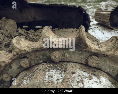 Detail of chain gear of  tracked vehicle. Crawler tracks hydraulics on a tractor or excavator. Track and gear. Stock Photo