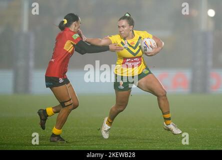 Papua New Guinea's Anika Butler (right) celebrates after scoring a try ...