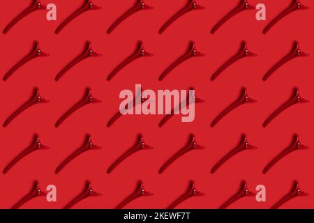 Red hair clip on red pattern Stock Photo