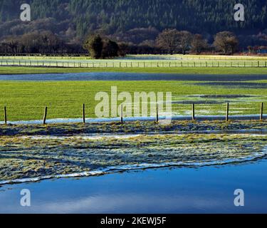 Frozen pools of water in the farmland pastures of the Conwy Valley on a frosty winters day in Snowdonia National Park Gwynedd North Wales UK. Stock Photo