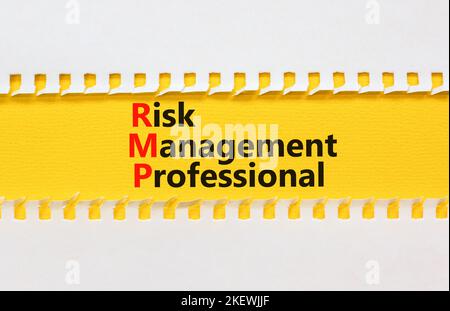 RMP risk management professional symbol. Concept words RMP risk management professional on yellow paper on a beautiful white background. Business RMP Stock Photo