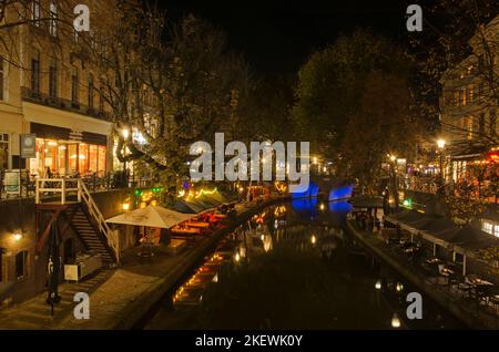 Utrecht, The Netherlands, November 14, 2022: night view of Oude Gracht (the Old Canal) lined with cafes and restaurants on its lower quay and shops al Stock Photo