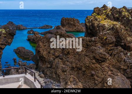 Natural pools with black volcanic rock in the Atlantic Ocean Porto Moniz, Madeira, Portugal Stock Photo