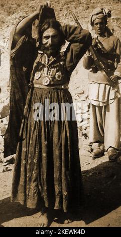 1930's a rebel prisoner dressed as a woman, one of 33 found at South Waziristan. They were nicknamed  nicknamed the 'Gaiety Chorus' or 'Gays '. Waziristan is a region of Pakistan belonging to the Federally Administered Tribal Area and is located on the border with Afghanistan and is divided into North  and South Waziristan.  In 1947 Waziristan became part of Pakistan Stock Photo