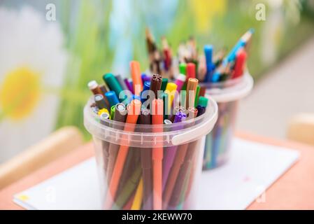 Drawing tools color pencils in glass beaker for kids Stock Photo