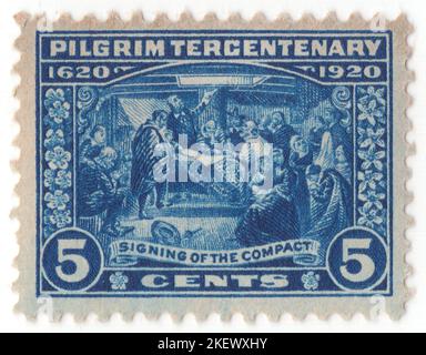 USA - 1920 December 21: An 5 cents deep blue postage stamp depicting Signing of the Mayflower Compact. Tercentenary of the landing of the Pilgrims at Plymouth, Massachusetts. The charter was incomplete for the Plymouth Council for New England when the colonists departed England (it was granted while they were in transit on November 3/13). They arrived without a patent; the older Wincob patent was from their abandoned dealings with the London Company. Some of the passengers, aware of the situation, suggested that they were free to do as they chose upon landing, without a patent in place Stock Photo