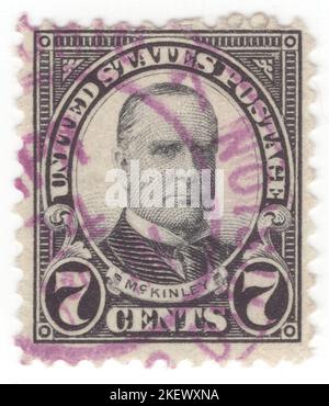 USA - 1923: An 7 cents black postage stamp depicting portrait of William McKinley. 25th president of the United States, serving from 1897 until his assassination in 1901. As a politician he led a realignment that made his Republican Party largely dominant in the industrial states and nationwide until the 1930s. He presided over victory in the Spanish–American War of 1898; gained control of Hawaii, Puerto Rico, the Philippines and Cuba; restored prosperity after a deep depression; rejected the inflationary monetary policy of free silver, keeping the nation on the gold standard Stock Photo