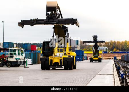 Container handlers. Forklift truck in shipping yard. Industrial container logistic yard. Logistics import export concept. Stock Photo