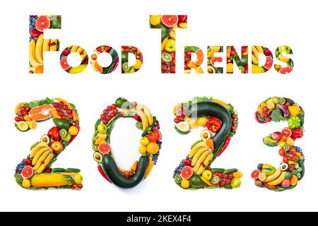 New year 2023 food trends. New Year 2023 made of vegetables, fruits and fish on white background. New years 2023 healthy food. 2023 resolutions, healt Stock Photo