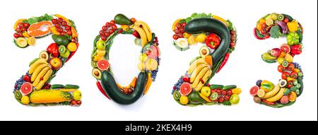 New year 2023 food trends. New Year 2023 made of vegetables, fruits and fish on white background. New years 2023 healthy food. 2023 resolutions, trend Stock Photo