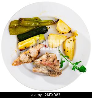 Roasted rabbit served with vegetable garnish Stock Photo