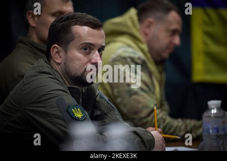 Mykolaiv, Ukraine. 14th Nov, 2022. Deputy Head of the Office of the President of Ukraine Kyrylo Tymoshenko, left, listens during a meeting on stabilizing the humanitarian situation following the liberation of Mykolaiv and Kherson regions, November 14, 2022 in Mykolaiv, Ukraine. Credit: Ukraine Presidency/Ukrainian Presidential Press Office/Alamy Live News Stock Photo