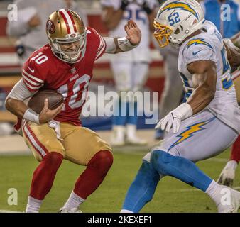 Santa Clara, California, USA. 13th Nov, 2022. San Francisco 49ers  quarterback Jimmy Garoppolo (10) attempts to get away form Los Angeles  Chargers linebacker Khalil Mack (52) on Sunday, November 13, 2021, at