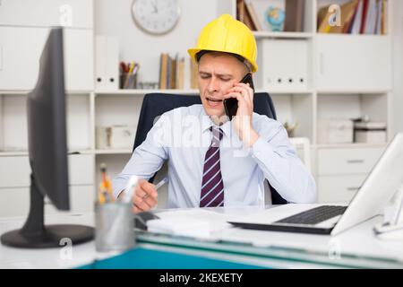 Portrait of american architect in yellow hard-hat Stock Photo