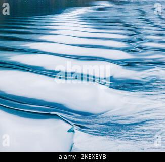 Motorboat creates graphic waves; Valdez Arm; Prince William Sound; Alaska; USA Stock Photo