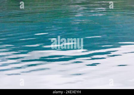 Motorboat creates graphic waves; Valdez Arm; Prince William Sound; Alaska; USA Stock Photo