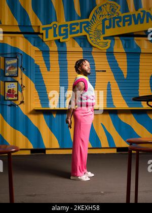 young man in colorful urban setting Stock Photo
