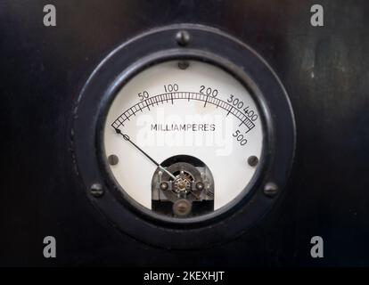 Closeup of a old analog milliammeter for 500 milliampere of direct current, isolated on black. Stock Photo
