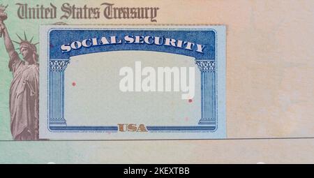 US Treasury check with Social Security identification card for pension, IRS tax or stimulus refund concept background Stock Photo