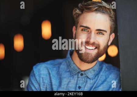 Ive always wanted to open a cafeNow I have. Portrait of a happy young man in a cafe. Stock Photo