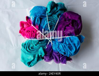 Tshirt Being tie dyed tie dying craft pattern Stock Photo