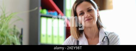 Portrait of smiling female doctor in clinic Stock Photo