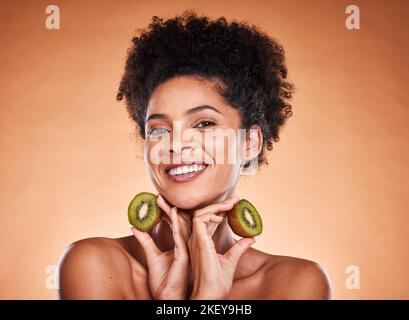 Kiwi fruit, beauty and black woman healthcare or vitamin c nutrition for skincare health. Portrait of African girl model, diet wellness or healthy Stock Photo