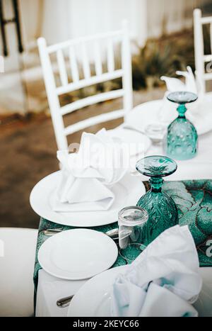 Tables set on event party or wedding reception. Luxurious and elegant table setting feature. Stock Photo
