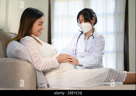 Young pregnant woman lays on bed wearing lacy bra and panties with her  naked pregnant belly. Relaxed and peaceful in this resting position, touching  t Stock Photo - Alamy