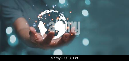 Businessman holding Global network connection. Big data analytics and business intelligence concept. World map point and line composition concept of g Stock Photo